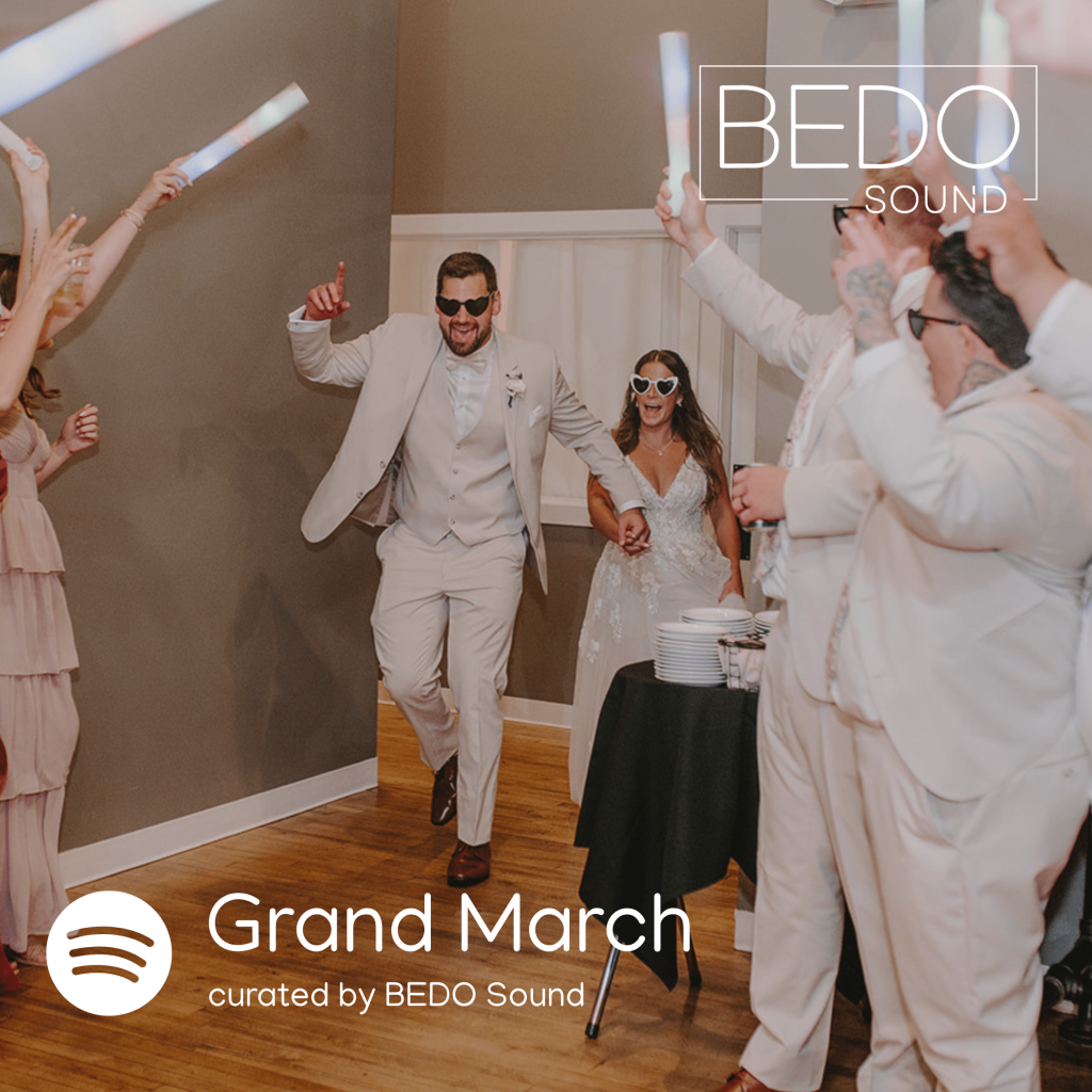 A bride and groom triumphantly entering their reception as the cover of 10 South Sound's "Grand March" playlist