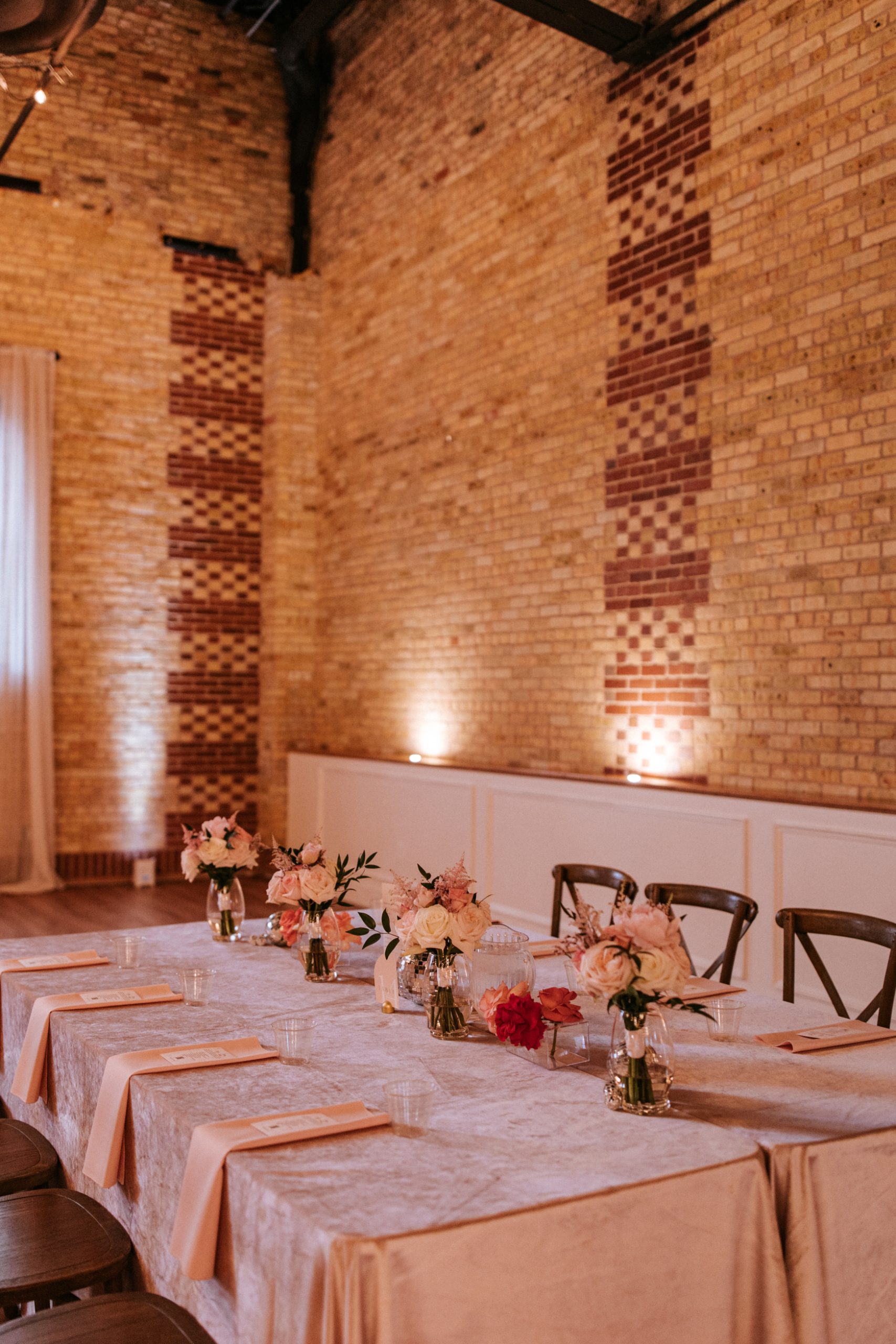 Romantic sweetheart table with soft florals at 10 South wedding reception